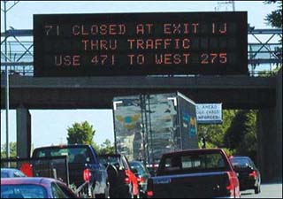 Photograph of heavy traffic on a highway.