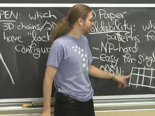 Professor Demaine in front of the chalkboard.