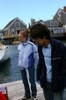 Two students standing on a dock.