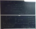 Radioactivity related equations on two blackboards.