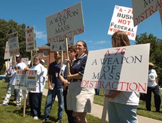 A photo of protestors with signs.