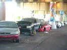 Flooded cars beneath the highway.