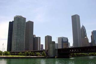 Photo of skyscrapers against a blue sky.