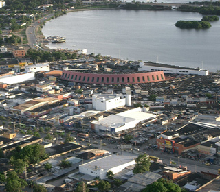 An aerial view of a marketplace by the water in Colombia.