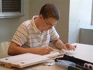 Student working on their guitar.