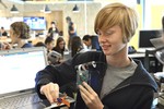 A photo of a girl looking at her built camera.